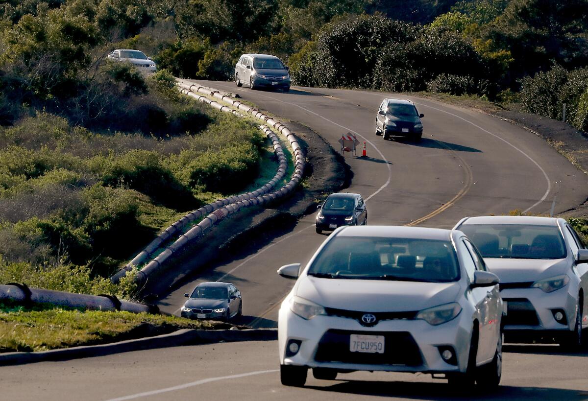 Sewage pipes run above ground along Palos Verdes Drive South at Portuguese Bend.