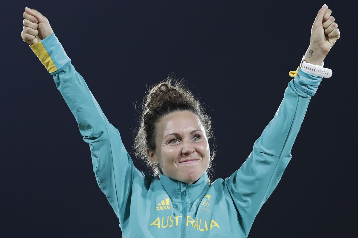 FILE - Chloe Esposito of Australia celebrates winning the gold medal at the awards ceremony of the women's modern pentathlon at the Summer Olympics in Rio de Janeiro, Brazil on Aug. 19, 2016. Modern Pentathlon Australia said Friday, Nov. 5, 2021 it supports a decision by the sport’s international governing body to remove the show jumping discipline from the Olympic competition after the 2024 Paris Games. (AP Photo/Natacha Pisarenko, File)