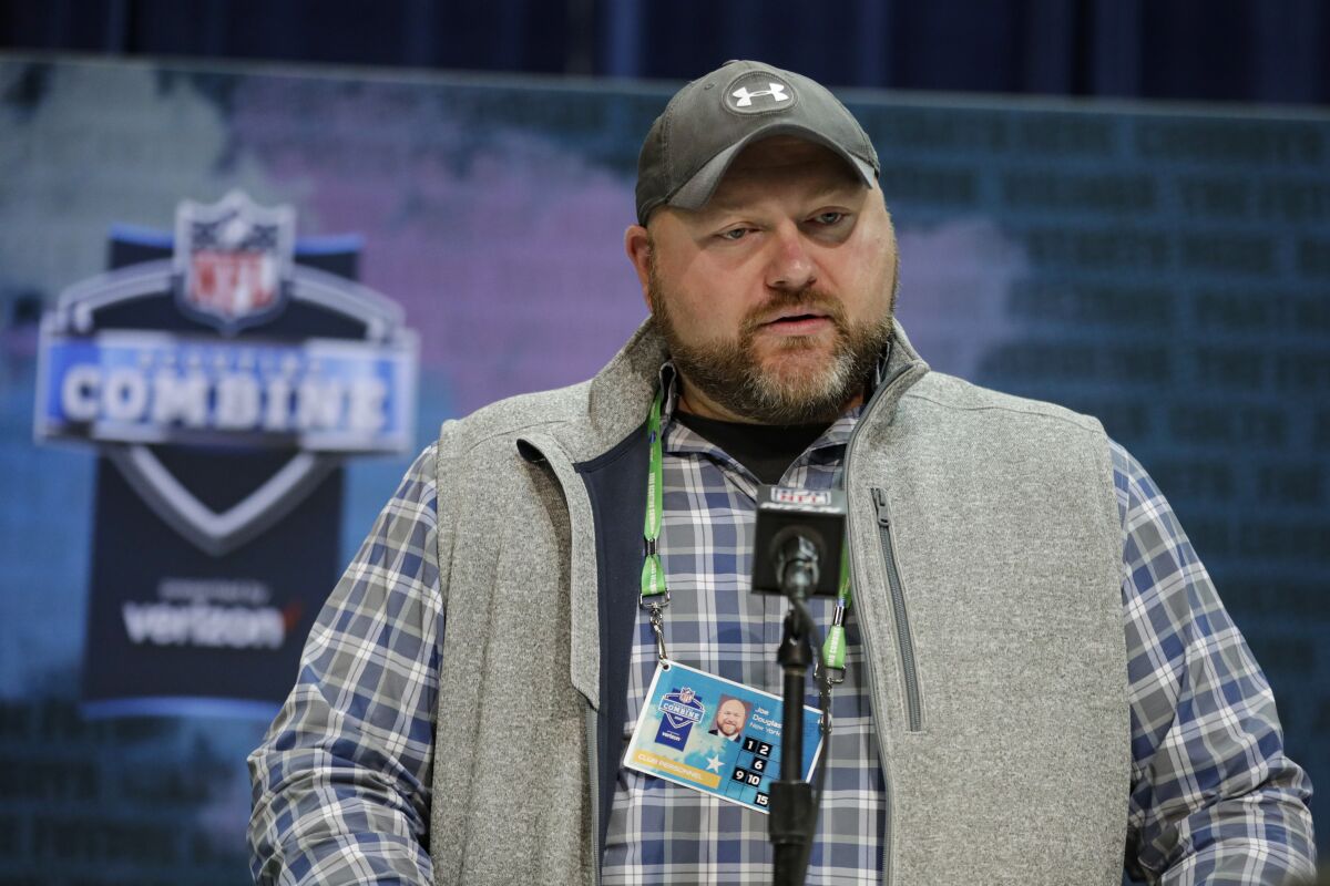 FILE - In this Feb. 25, 2020, file photo, New York Jets general manager Joe Douglas speaks during a news conference at the NFL football scouting combine in Indianapolis. Douglas is not going to start patting himself on the back after a busy offseason. Douglas made several moves to help the team get better, but he knows they're still very much a work in progress. (AP Photo/Michael Conroy, File)