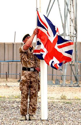 TRANSFER: British soldier takes down the Union Jack.