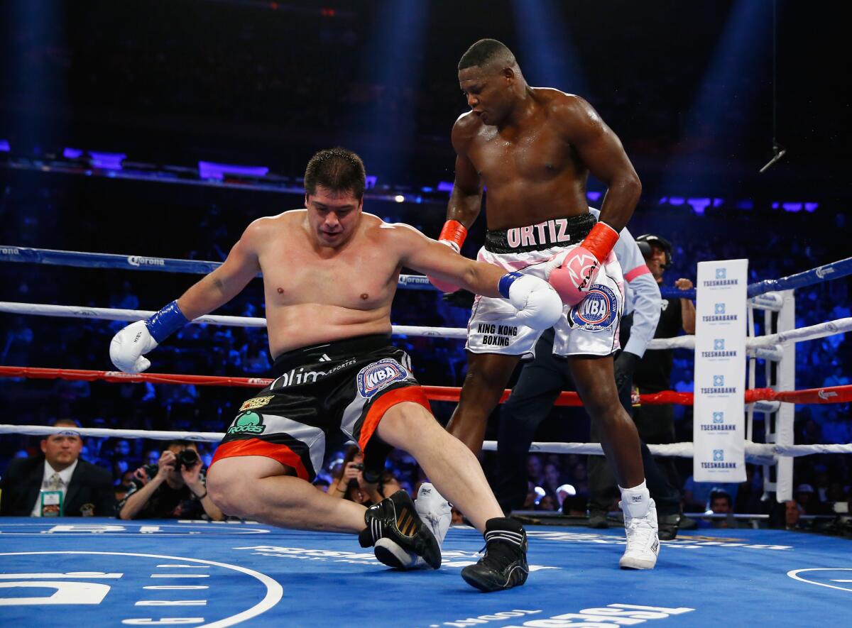 Luis Ortiz knocks down Matias Ariel Vidondo on Oct. 17.
