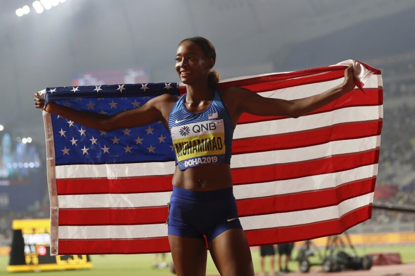 Dalilah Muhammad, of the United States the gold medal winner celebrates after the women's 400 meter hurdles final at the World Athletics Championships in Doha, Qatar, Friday, Oct. 4, 2019. (AP Photo/Petr David Josek)