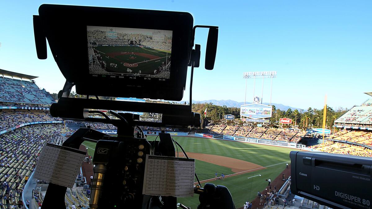 A television camera is trained on the field at Dodger Stadium before Monday's game between the Dodgers and Angels.