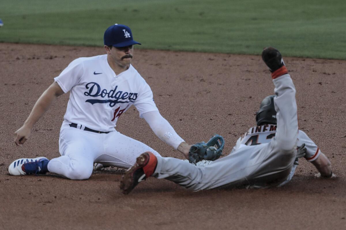 Giants baserunner Darin Ruf steals second in front of Dodgers second baseman Kiké Hernández.