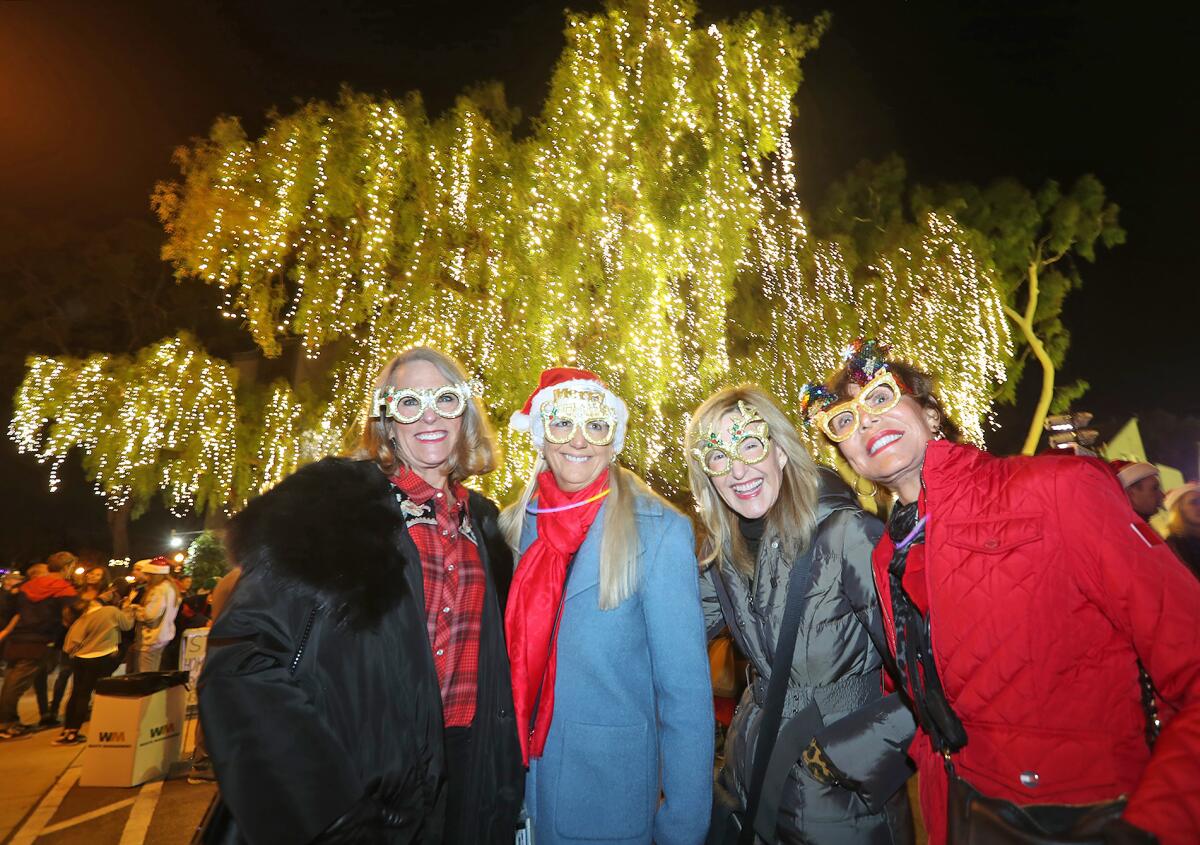 A group of friends who call themselves the Vic Beach Girls show off their reindeer glasses.
