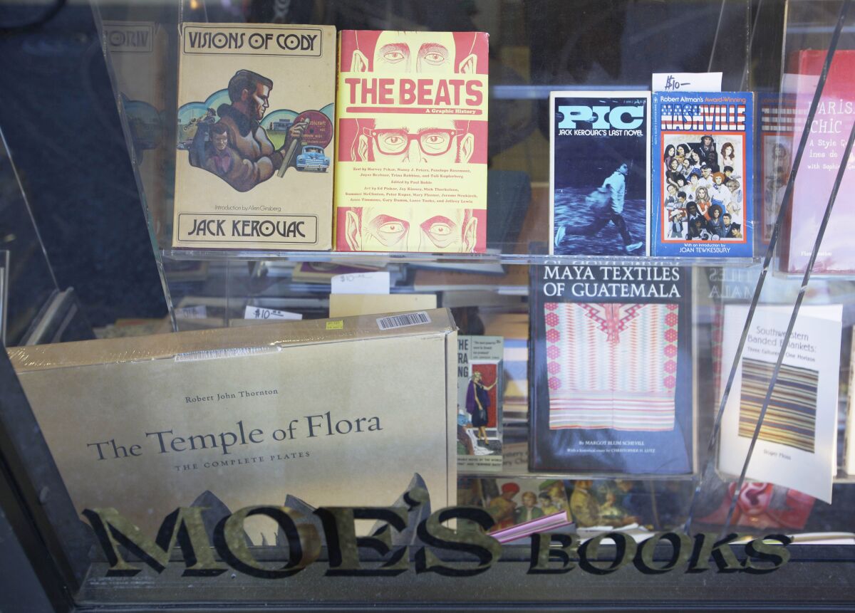 FILE - A variety of books appear in the window of Moe's Books on Telegraph Avenue in Berkeley, Calif. on June 1, 2011. Moe’s Books was founded in the late 1950s by the activist Moe Moskowitz, part of the Free Speech and anti-war movements in the 1960s. Moe's is now run by his daughter, Doris Moskowitz, who has spoken of the store's egalitarian atmosphere and its tradition of valuing social consciousness alongside making a profit. (AP Photo/Eric Risberg, File)