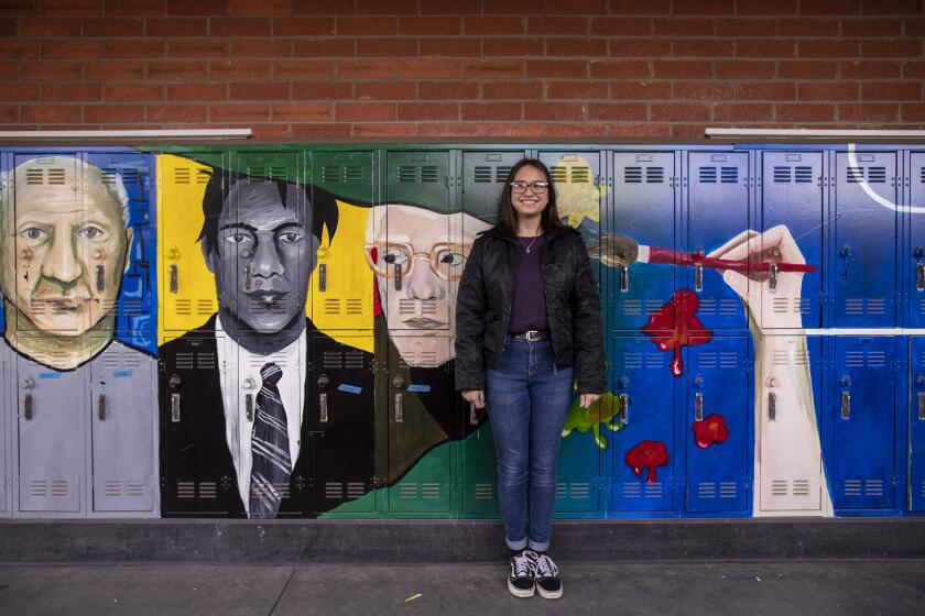 ALHAMBRA, CA - MARCH 11: Meghan Webster, a sophomore at Alhambra High School, sits for portraits on the nearly empty campus on Thursday, March 11, 2021 in Alhambra, CA. (Brian van der Brug / Los Angeles Times)