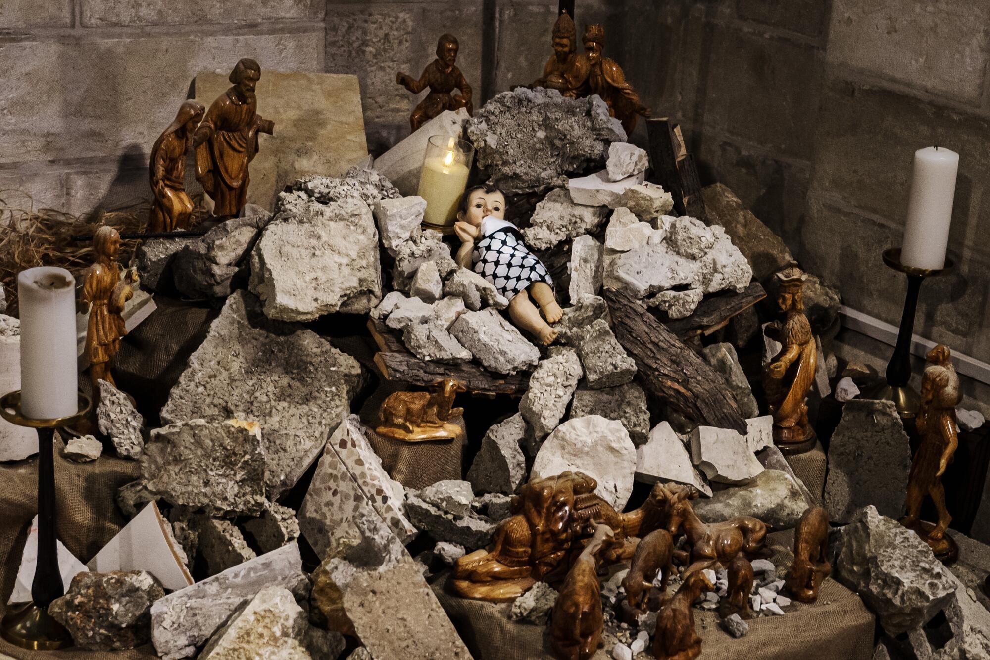 A pile of jagged stones with a baby Jesus figurine