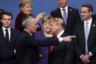 FILE - NATO Secretary-General Jens Stoltenberg, front center left, speaks with U.S. President Donald Trump, front center right, after a group photo at a NATO leaders meeting at The Grove hotel and resort in Watford, Hertfordshire, England, Dec. 4, 2019. As Trump becomes the first former president to face federal charges that could put him in jail, many Europeans are watching the case closely. But hardly a single world leader has said a word recently about the man leading the race for the Republican party nomination. (AP Photo/Francisco Seco, File)