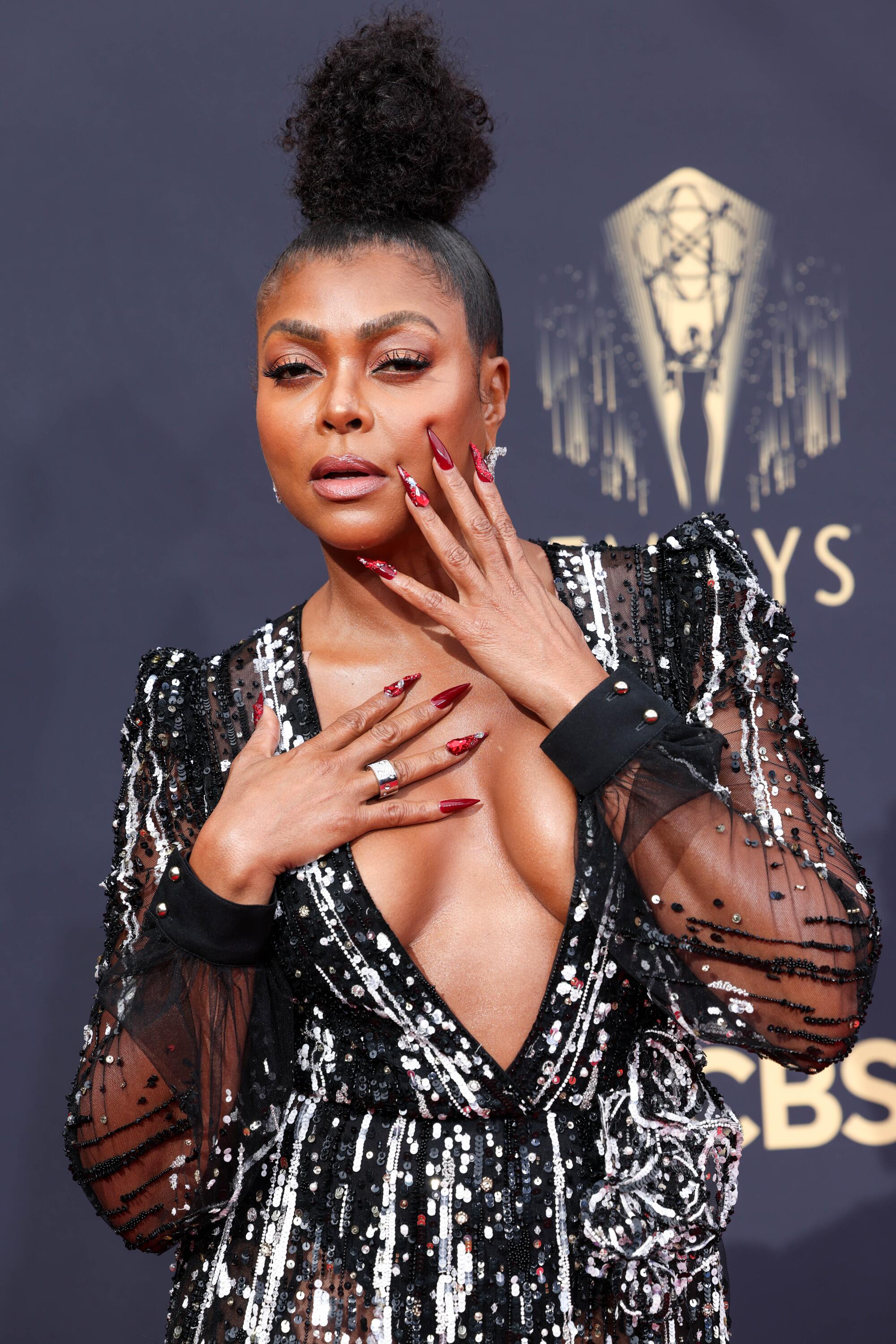 Taraji P. Henson in a sparkly black and silver low-cut Elie Saab gown.