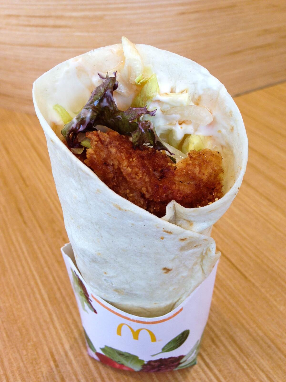 All three of McDonald's new Premium McWrap sandwiches are made with chicken that can be ordered crispy or grilled. Above, the crispy Sweet Chili Chicken version.