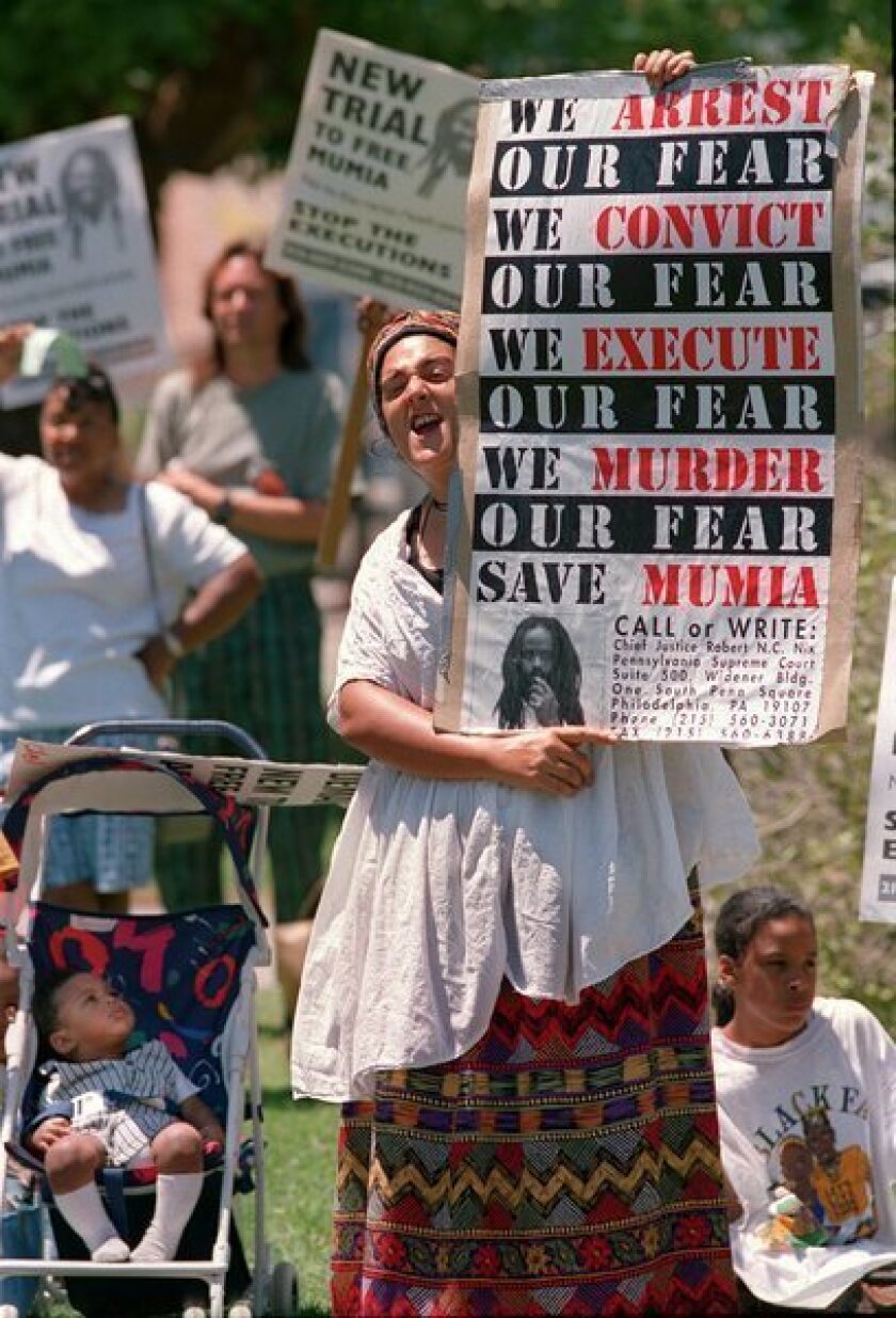 Suezy Johnson protests during a 1990s demonstration in support of Mumia Abu-Jamal.
