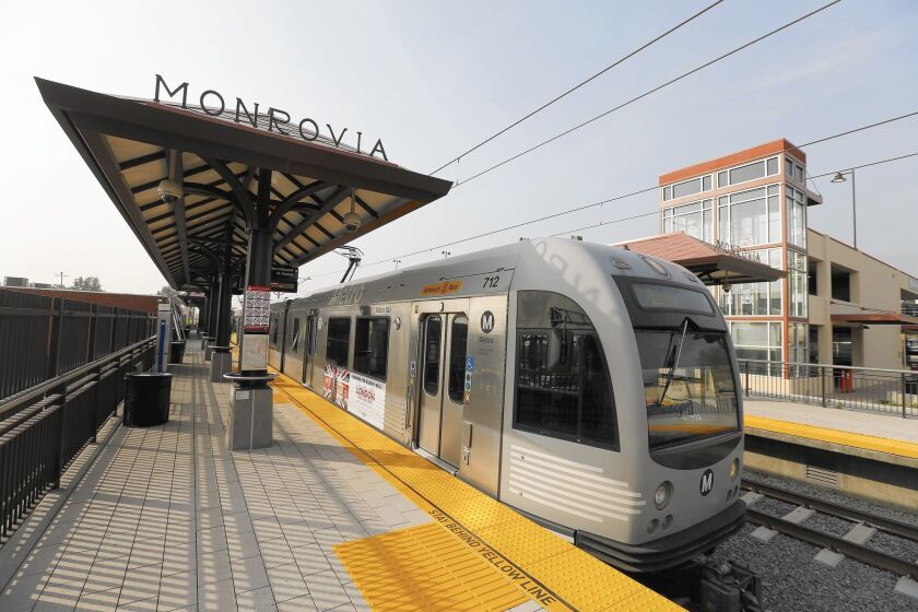The Metro Gold Line departs Monrovia's Station Square during testing. The city recently completed $25 million worth of infrastructure improvements and new facilities, including a park and band shell at the square.