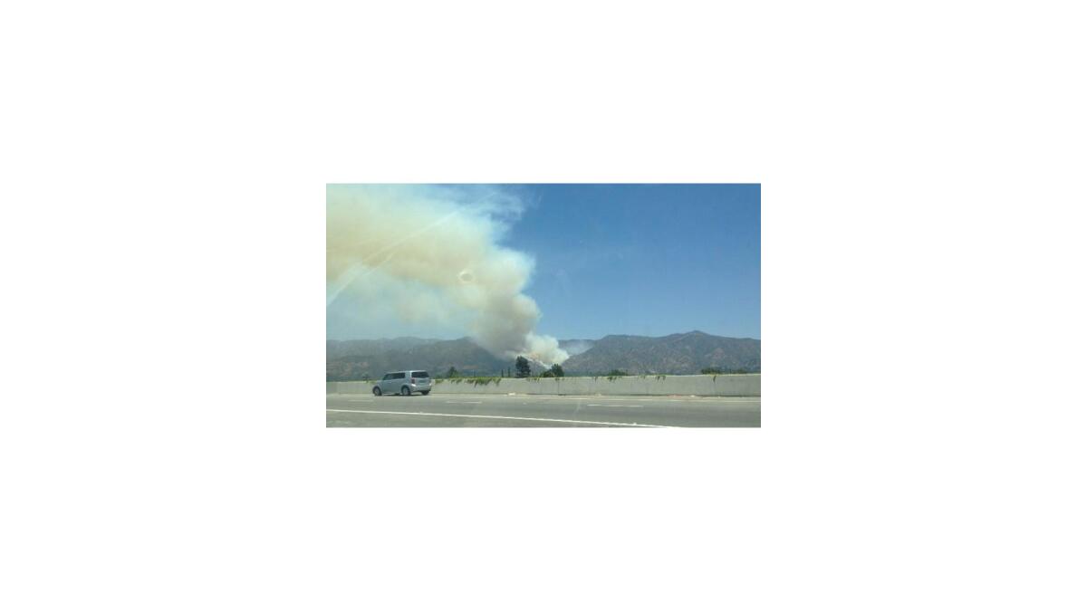 Smoke from a fire burning in Glendale can be seen from the 5 Freeway.