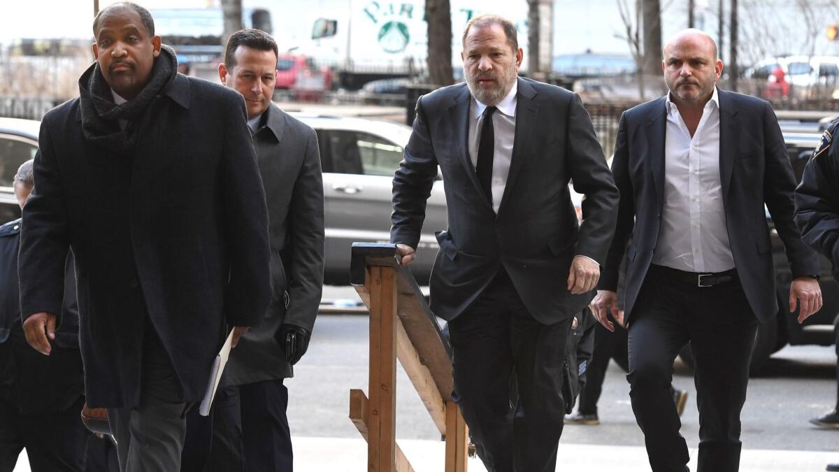 Harvey Weinstein arrives at the State Supreme Court with his new lawyers, Ronald Sullivan and Jose Baez, in New York, NY on Jan. 25.