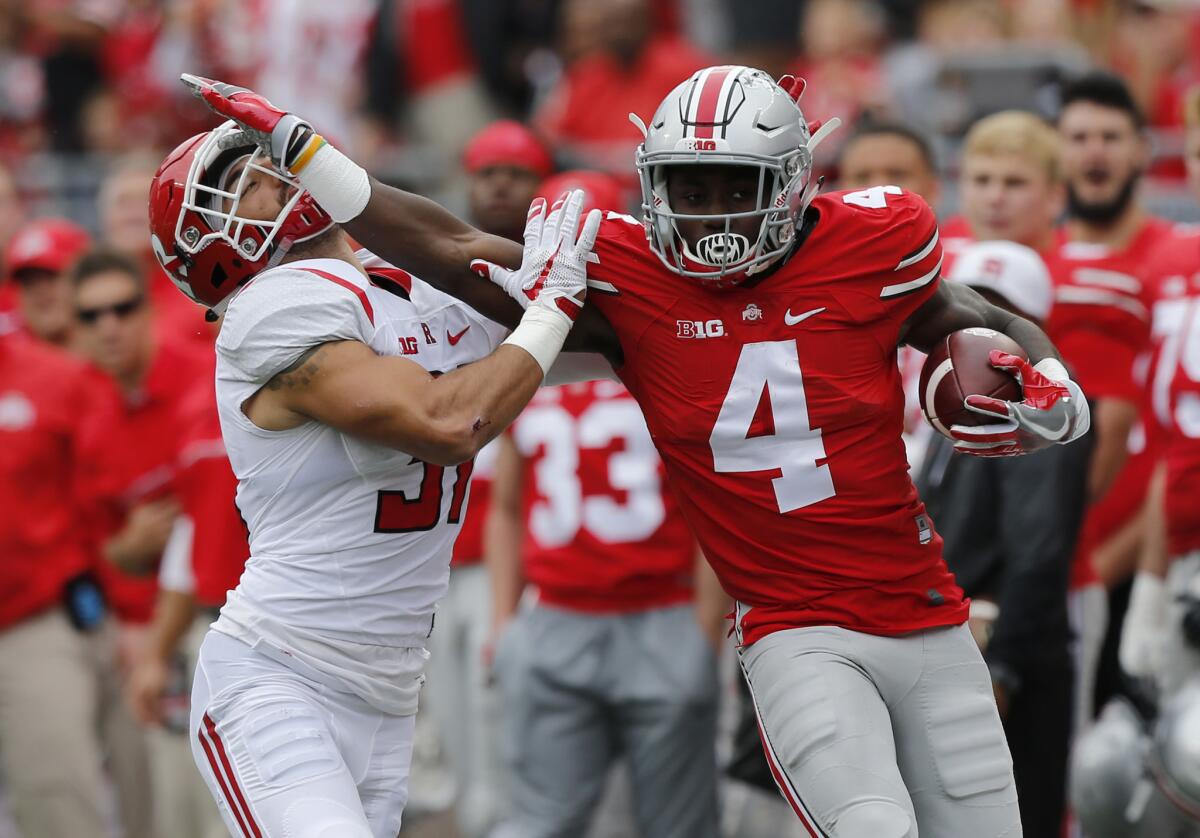 Ohio State running back Curtis Samuel, stiff arms Rutgers defensive back Anthony Cioffi on Oct. 1.