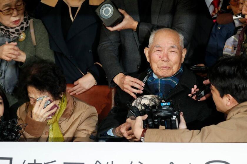 Mandatory Credit: Photo by JEON HEON-KYUN/EPA-EFE/REX (9948443i) South Korean Lee Chun-sik (R, wheelchair, 94 years) who is a victim of Japan's forced labor during the Japanese colonial rule of Korea (1910-45), speaks to medias after court's ruling at the Supreme Cort in Seoul, South Korea, 30 October 2018. South Korea's Supreme Court reaffirmed on 30 October, a 2013 ruling that ordered a Japanese steelmaker to compensate four South Koreans for wartime forced labor and unpaid work. The top court upheld the damages claims filed by the four victims and ordered Nippon Steel and Sumitomo Metal Corp. (NSSM) to pay each victim 100 million won or 87,720 US dollars. South Korea Ruling on Japan's Forced Labor, Seoul - 30 Oct 2018 ** Usable by LA, CT and MoD ONLY **