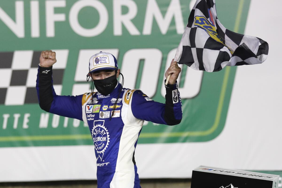 Chase Elliott celebrates after winning a NASCAR Cup race at Charlotte Motor Speedway on Thursday.
