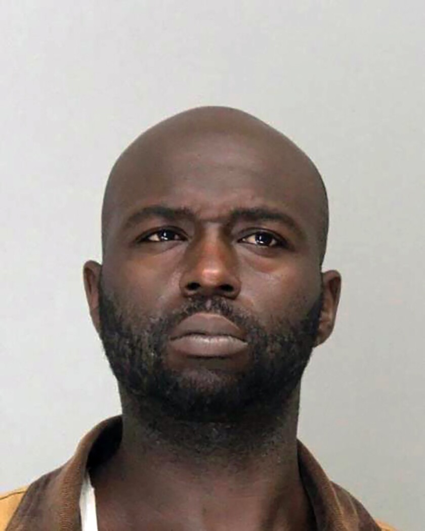 FILE - This undated booking photo provided by the Dallas County Sheriff's Office shows Henry “Michael” Dwight Williams. Federal prosecutors say Williams, who sold a pistol to a man who used it to hold four hostages inside a Texas synagogue before being fatally shot by the FBI earlier this year, pleaded guilty Thursday, June 30, 2022 to a federal gun crime. (Dallas County Sheriff's Office via AP)