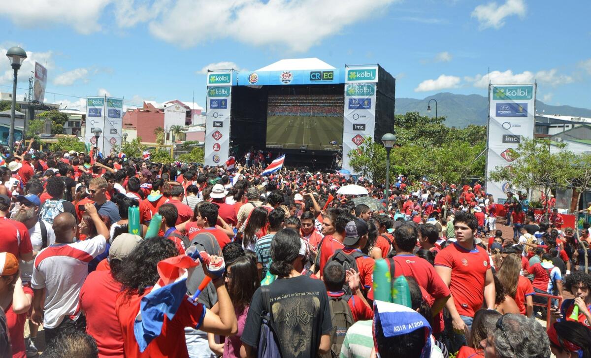 Costa Rican fans gather at Democracy Square in San Jose on Friday to watch their team defeat Italy, 1-0, to reach the knockout round of the World Cup.