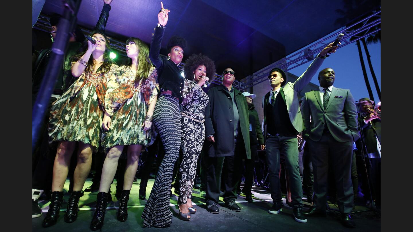 Steve Wonder joins other musical guests to entertain thousands at a public memorial for Prince at L.A. City Hall.