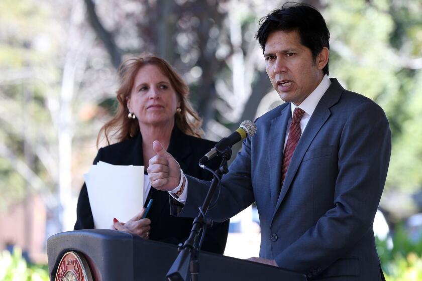 State Sen. Noreen Evans (D-Santa Rosa), left, looks on as state Sen. Kevin de Leon (D-Los Angeles) speaks during a news conference on guns last year. Evans is being replaced as chairwoman of the Judiciary Committee.