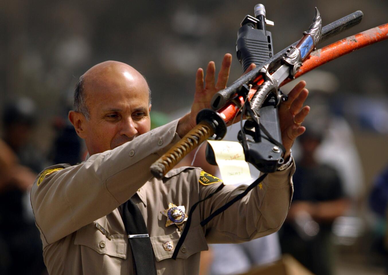 Sheriff Lee Baca shows weapons confiscation