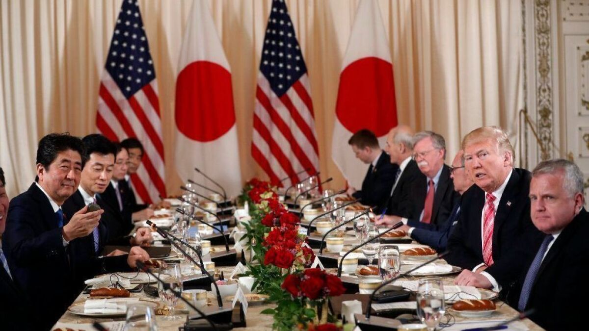 President Trump and U.S. officials hold a working lunch with Japanese officials including Prime Minister Shinzo Abe, left, at Mar-a-Lago in Palm Beach, Fla.