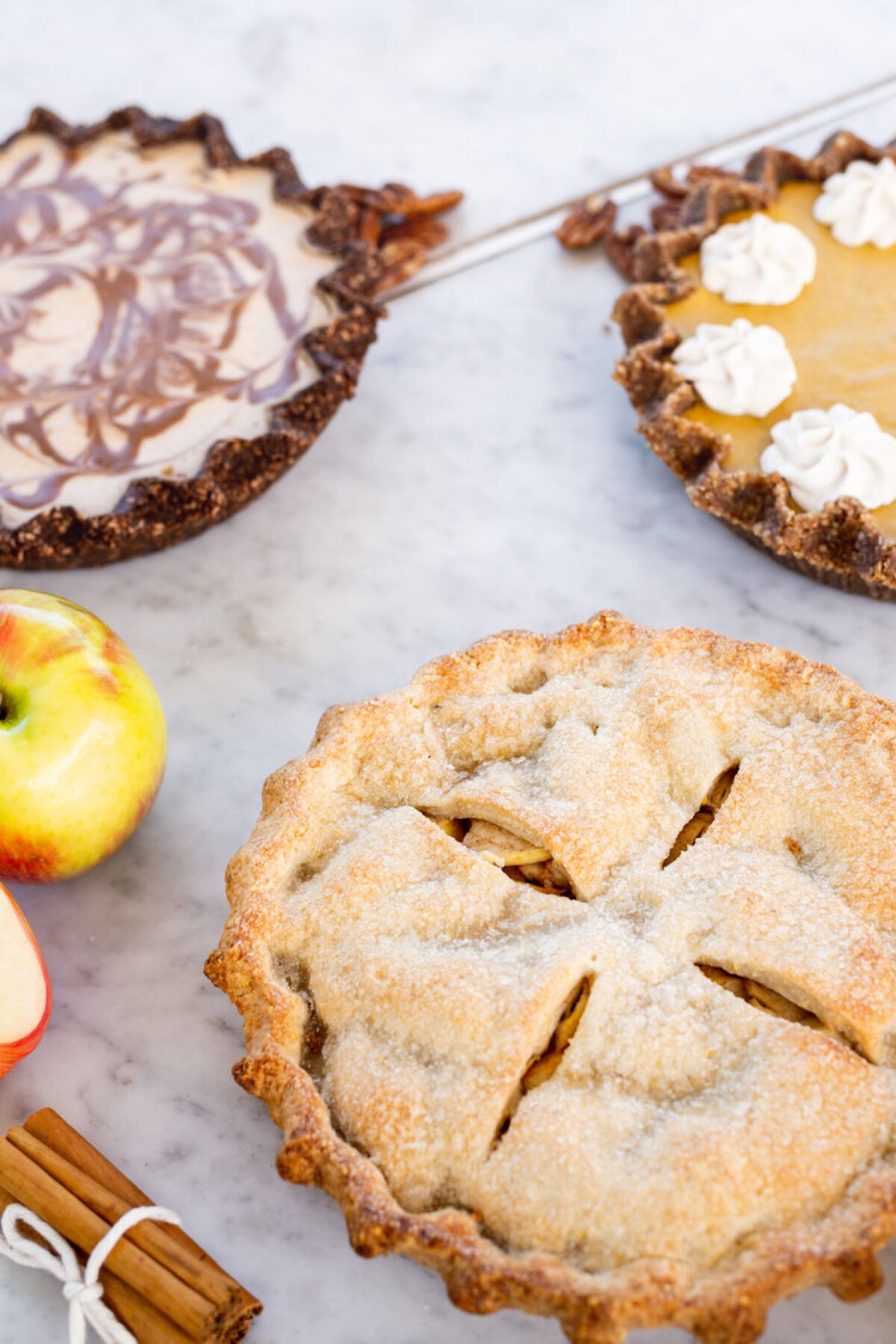 Baked apple, chocolate coconut cream and pumpkin pies from Café Gratitude