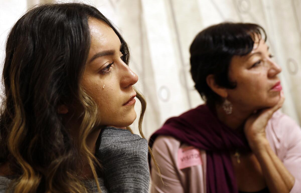 Alejandra Campoverdi's sister Monica Medellin, with their mother, Cecilia Medellin, becomes emotional talking about her late grandmother. (Christina House / Los Angeles Times)