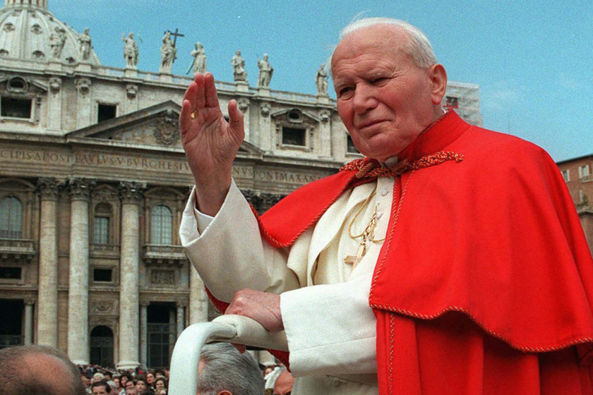 Pope John Paul II waves to the crowd in St. Peter's Square at the Vatican on April 23, 1997.