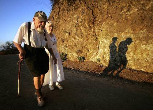 Sol Shankman, 93, and his companion, Anneliese Clay, 81, walk along Griffith Park's Riverside Trail, east of the Greek Theatre. He began hiking in the park in 1976 after suffering from angina. At first, it was principally therapeutic, he says. But I just kept on walking. Shankman has been walking pretty much every day since then  42,000 miles, by his reckoning,