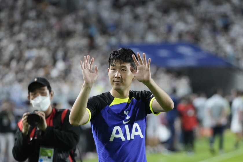 Tottenham Hotspur's Son Heung-min greets football fans after the pre-season soccer match between Tottenham Hotspur FC and Sevilla FC at Suwon World Cup Stadium in Suwon, South Korea, Saturday, July 16, 2022. (AP Photo/Ahn Young-joon)