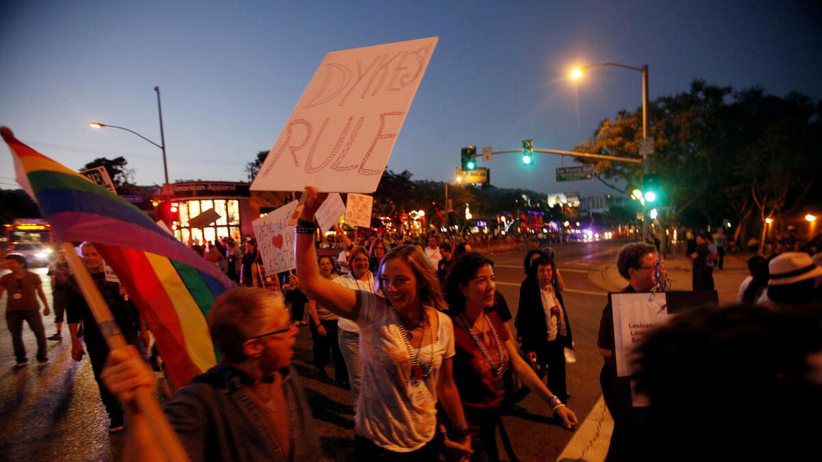People participate in the annual WeHo Dyke March on Santa Monica Boulevard in West Hollywood in 2012.