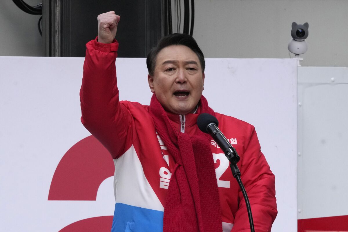Yoon Suk Yeol, the presidential candidate of the main opposition People Power Party, speaks during a presidential election campaign in Seoul, South Korea, Tuesday, Feb. 15, 2022. Candidates kicked off official campaign on Tuesday for South Korea's presidential election on March 9. (AP Photo/Ahn Young-joon)