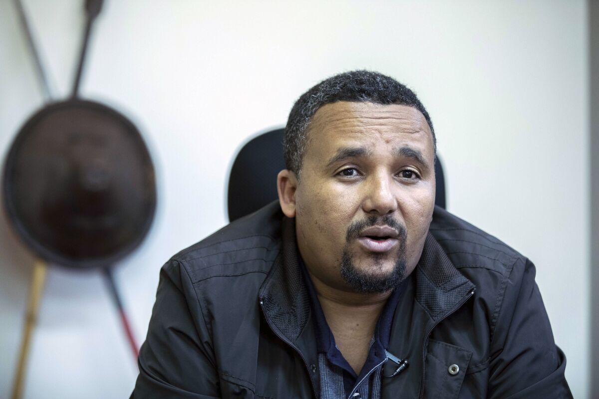 FILE - Opposition politician Jawar Mohammed speaks during an interview with The Associated Press at his house in Addis Ababa, Ethiopia on Oct. 24, 2019. Ethiopia's government on Friday, Jan. 7, 2022 announced an amnesty for some of the country's most high-profile political detainees, including opposition figure Jawar Mohammed and senior Tigray party officials, as Prime Minister Abiy Ahmed spoke of reconciliation for Orthodox Christmas. (AP Photo/Mulugeta Ayene, File)