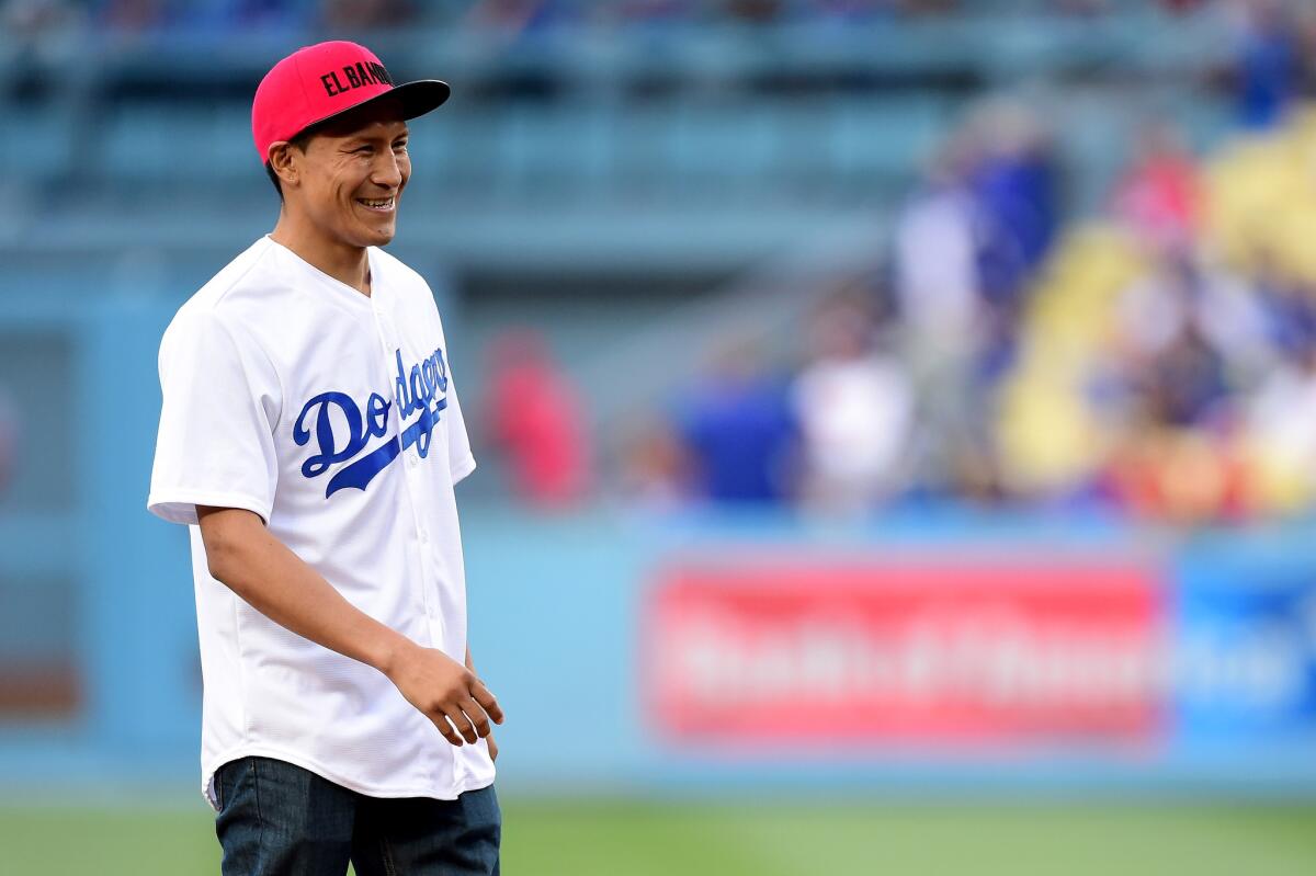 WBC super-featherweight champion Francisco Vargas smiles after throwing out the ceremonial first pitch at Dodger Stadium on May 25.