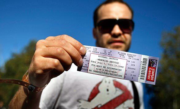 Fans collect their tickets to Michael Jackson memorial