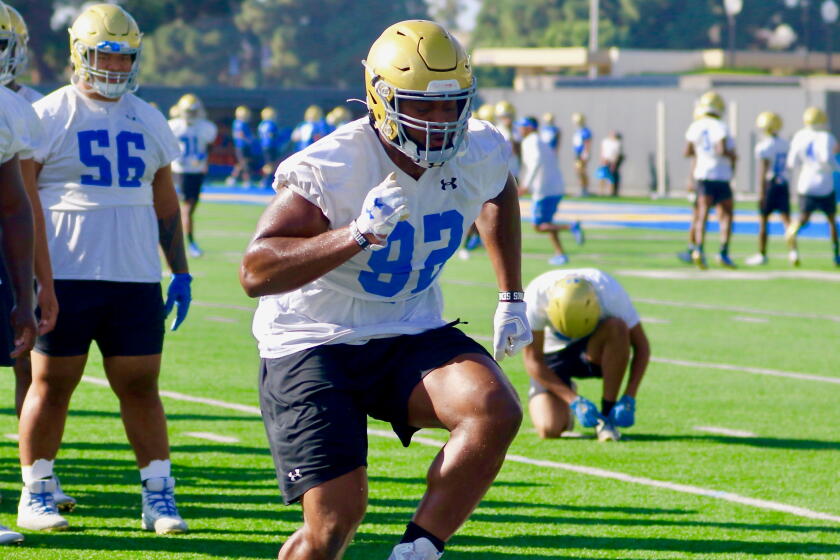 Junior defensive lineman Osa Odighizuwa participates in an agility drill during a team practice session on Oct. 8, 2019.