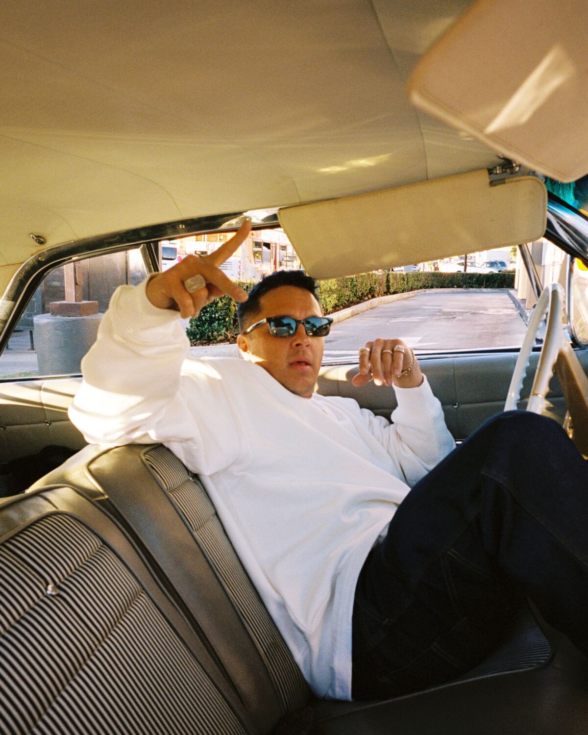 Chris Printup gestures while sitting in the front seat of a car