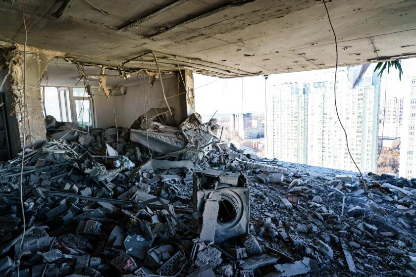 KYIV, UKRAINE -- FEBRUARY 26, 2022: A rocket hits a residential building and destroys several floor of homes in Kyiv, Ukraine, Saturday, Feb. 26, 2022. (MARCUS YAM / LOS ANGELES TIMES)