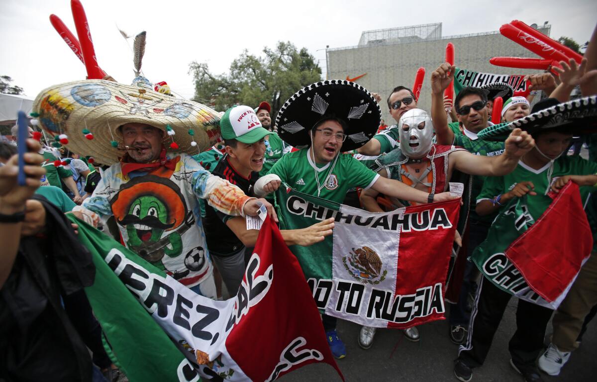 Mexico's fans cheer as they arrive for a World Cup soccer qualifying match between mexico and the U.S. at Azteca Stadium in Mexico City, Sunday, June 11, 2017.