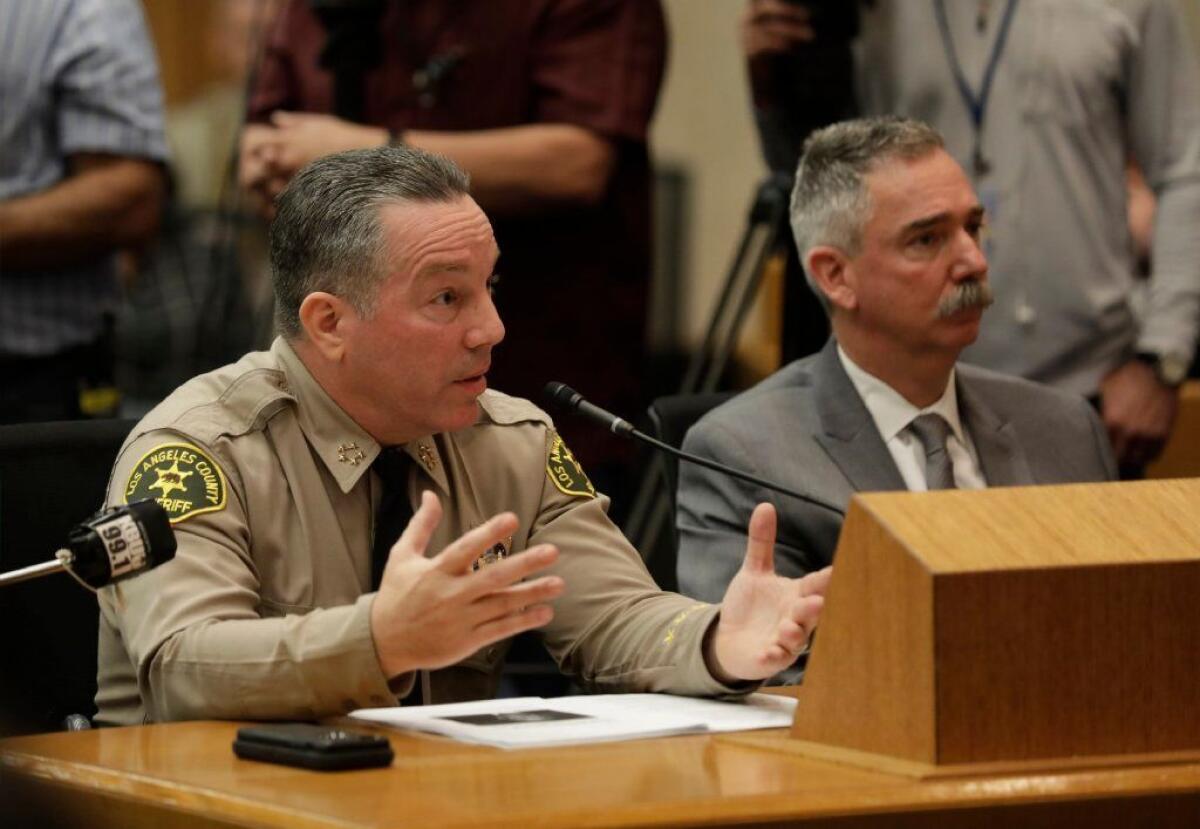 During a hearing before the Los Angeles County Board of Supervisors in January, Sheriff Alex Villanueva defends his decision to reinstate a campaign aide who had been fired.