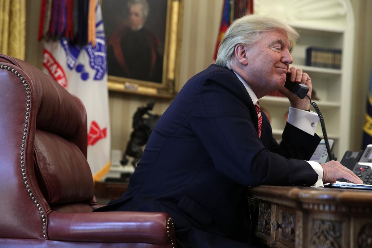 Donald Trump speaks on the phone with Irish Prime Minister Leo Varadkar in the Oval Office on Tuesday.