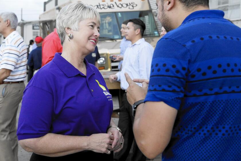 Houston Mayor Annise Parker greets a supporter at a fundraiser for the Houston Equal Rights Ordinance last month. "It is my life that is being discussed.... The debate is about me," she said of the issue last year.