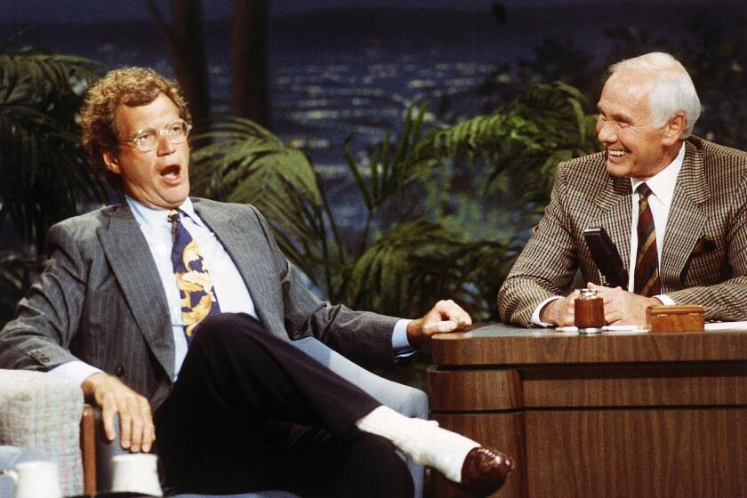 David Letterman appears with Johnny Carson on "The Tonight Show" Aug. 30, 1991.