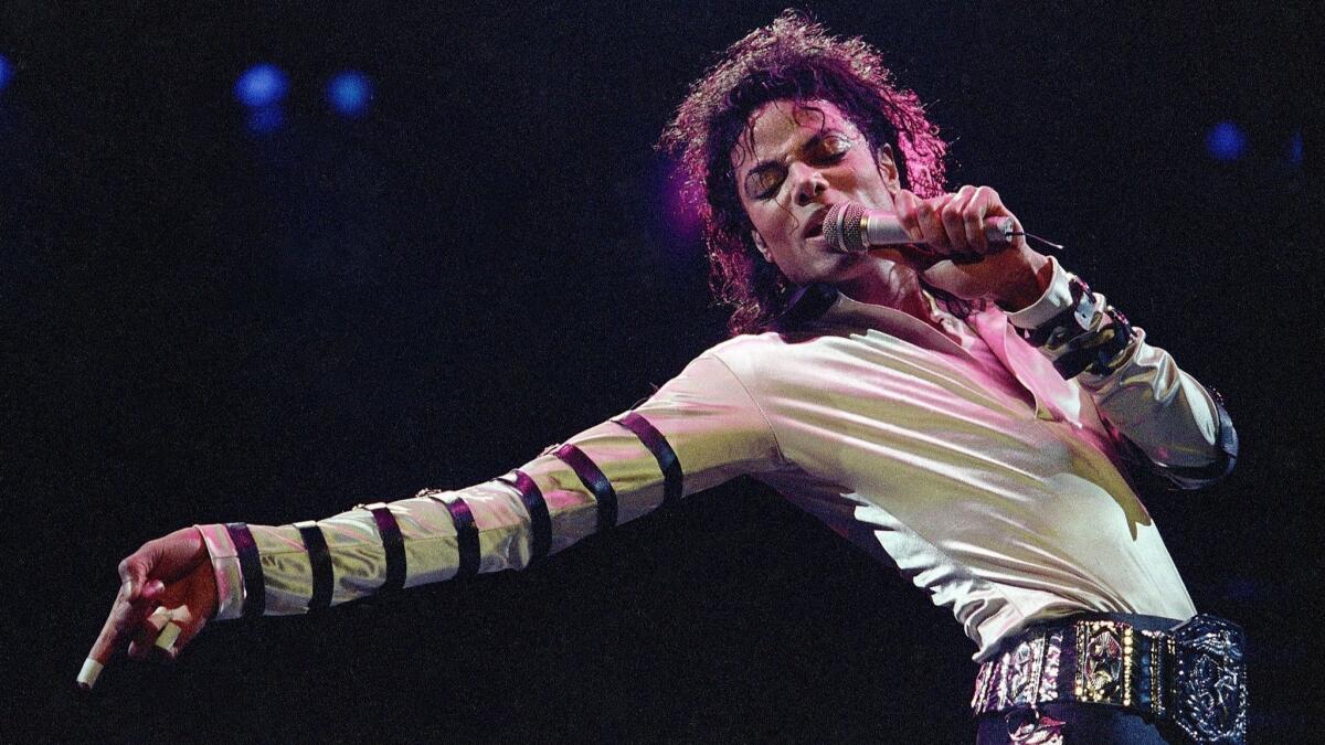 Michael Jackson performs at a show in 1988.