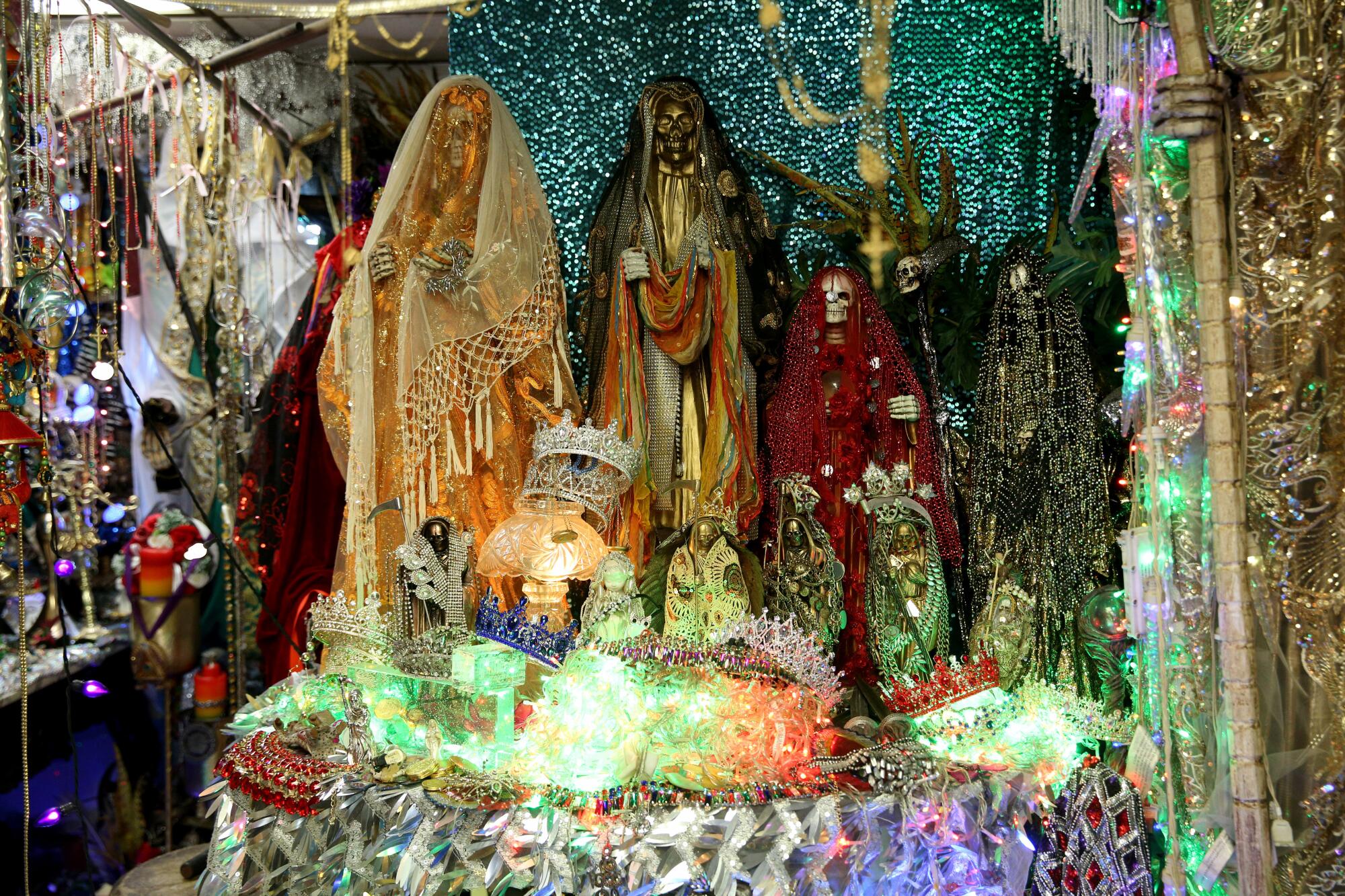 An altar with statues of Santa Muerte