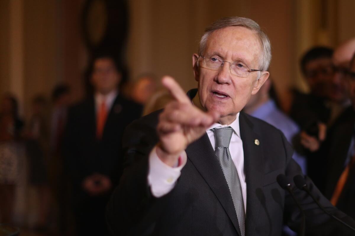 Senate Majority Leader Harry Reid (D-Nev.) talks to reporters at the Capitol on Tuesday.