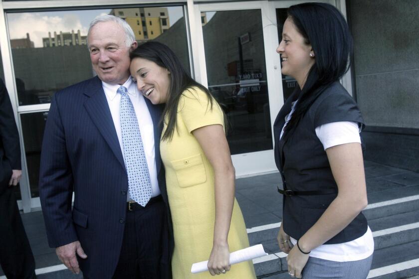 Jerry Sanders hugs his daughter Lisa alongside her wife Meaghan Yaple after he testified in 2010 against Proposition 8, the ballot initiative that banned same-sex marriage in California. Sanders, a Republican, had defied many in his party to support gay marriage.